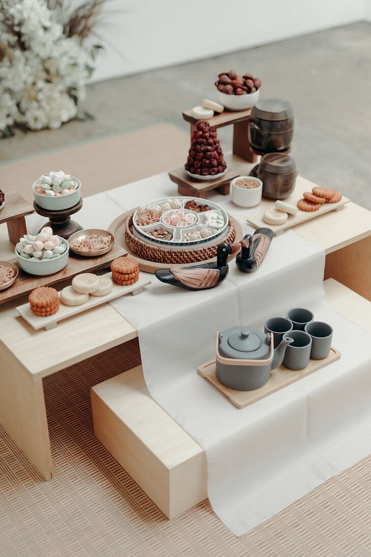 Small Cakes and Sweets on Low Table Setup for Traditional Korean Paebaek Tea Cerermony