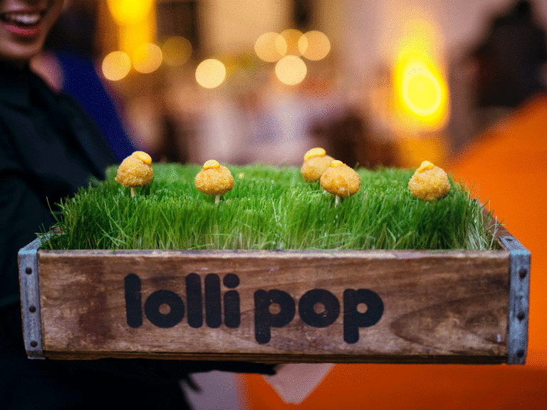 Mac and cheese lollipops served at a winter wedding. 
