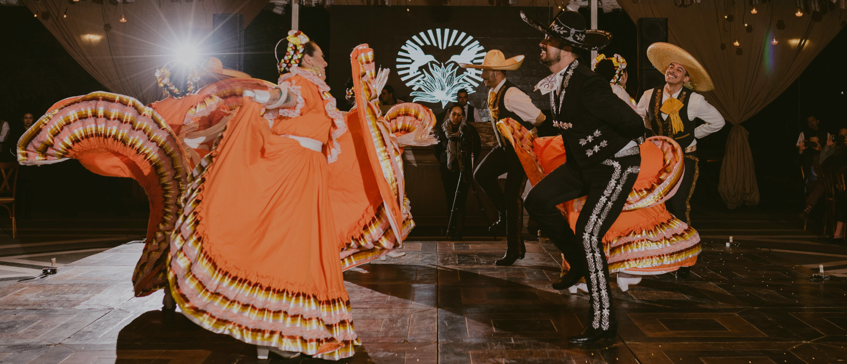 A group of dancers in festive traditional attire.