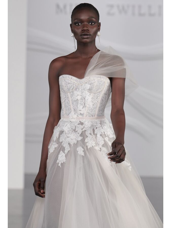 Mira Zwillinger strapless wedding dress with sweetheart neckline and asymmetrical tulle sleeve
