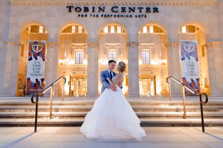 To keep travel time low and uncomplicated, the ceremony and the reception were at the modern Tobin Center for the Performing Arts in downtown San Antonio, Texas. The breathtaking floor-to-ceiling lights and monstrously tall ceilings gives the space a chic ambiance.