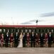 Wanting their wedding party to be comfortable and be able to show off a little of their own personal styles, Karen and Casey gave their bridesmaids and groomsmen some freedom with their wedding day looks. They requested only that the guys wear black suits and the girls choose cocktail dresses in a shade of gray—and that nobody match.