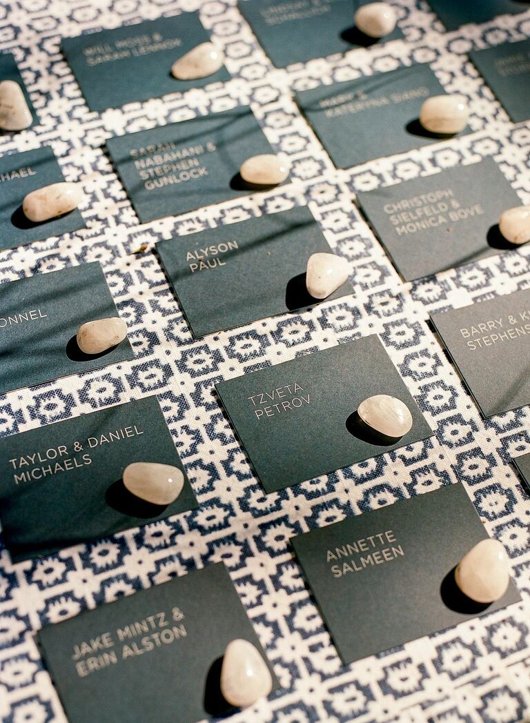 Modern escort card display with brown rocks