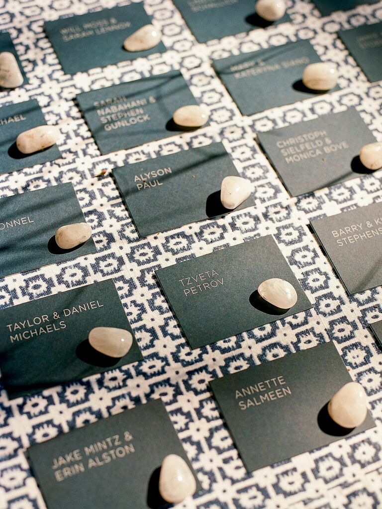 Modern escort card display with brown rocks