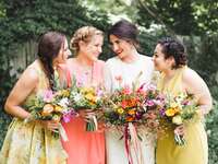 Bride posing with bridesmaids