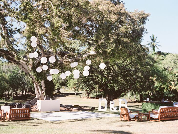 White paper lanterns and wooden letters lent a playful feel to the open, airy reception space.