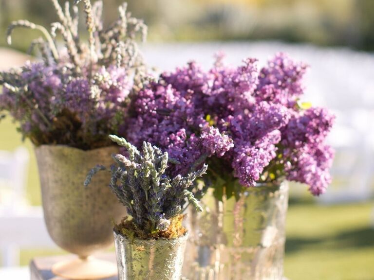 fresh purple lilacs in mercury glass vases