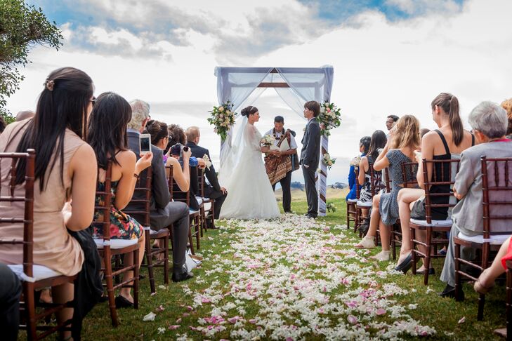 "We were married at Kahua Ranch on the rolling hills on the Big Island of Hawaii, an we had a rustic wedding overlooking the ocean," says Tara. "It was a small intimate wedding of 100 of our closest family and friends, and the weather was perfect."
