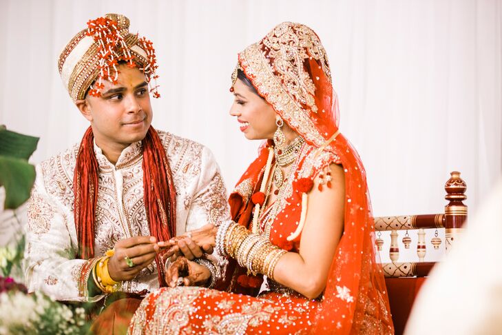 Vineeta knew she wanted a traditional Indian bridal look. She chose this red sari embellished with gold and Swarovski crystals from from Frontier Heritage in Toronto, Ontario. It was one of the first outfits she tried on and was love at first site.