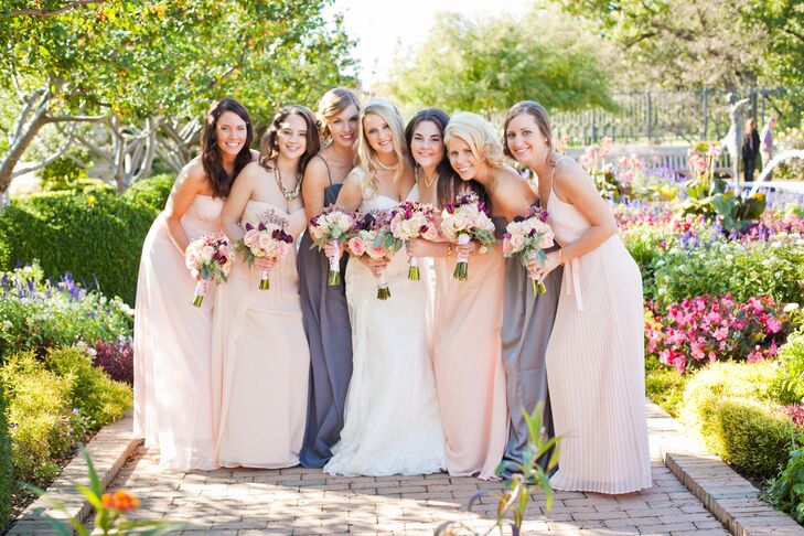 Kristen told her bridesmaids that as long as their dresses were either gray or blush, they could wear whatever style they wished, allowing each bridesmaid's unique sense of style to shine through.