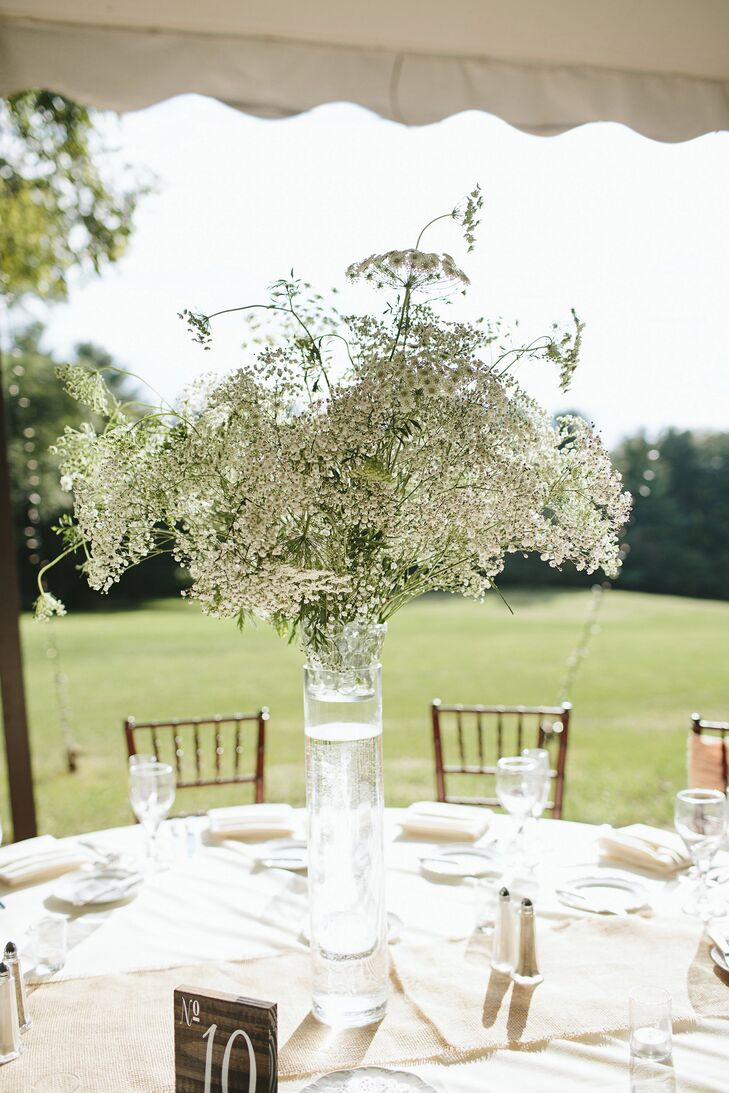 Tall centerpieces topped some of the guest tables, and were filled with lacy white blooms like baby's breath and bridal veil.
