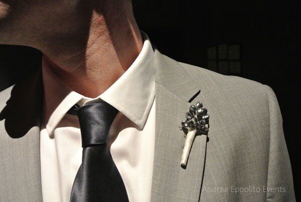 James pinned a simple gray boutonniere made out of pressed pearls onto his lapel.