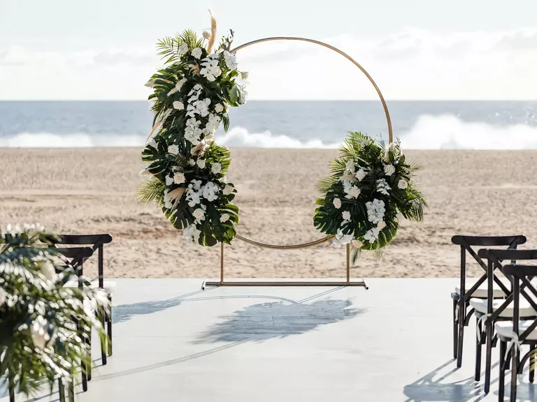 Beach Wedding Ceremony With a Circle Arch