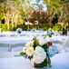 Centerpieces filled with a fresh mix of blue and white hydrangeas accented by red hypericum berries brought a light preppy touch to the reception tabletops.