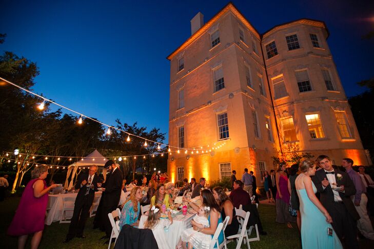 A stately, historic venue was just what Helen and Glenn's traditional wedding called for and they found it in the Spoleto Festival USA building (also known as the Murray Center). The newlyweds and their guests spent a lively evening of dinner dancing out on the Center's lawns with the band Mike & the Mixers busting out the 80s beats.rn