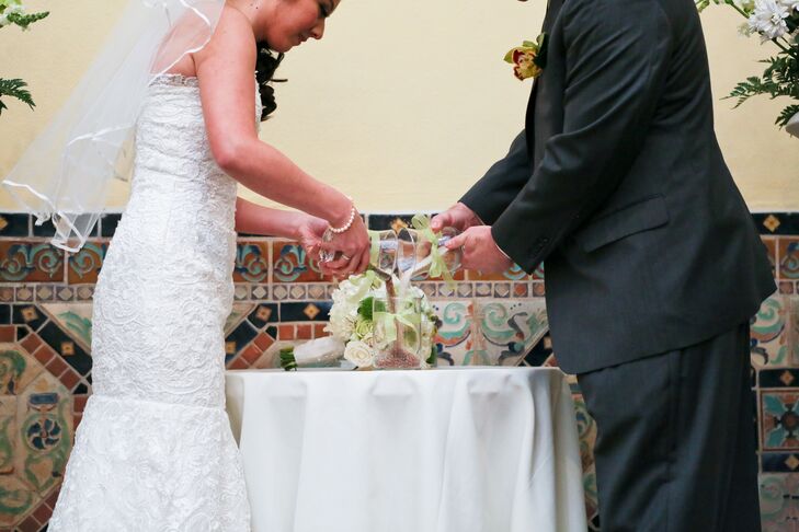 Jennifer and Shawn had a sand ceremony, where ether both poured two individual containers of sand into one.