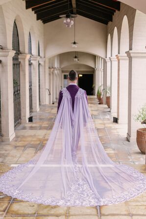 Groom in Unique, Custom-Made Purple Tulle Cape at Cathedral Length With Lace Detailing