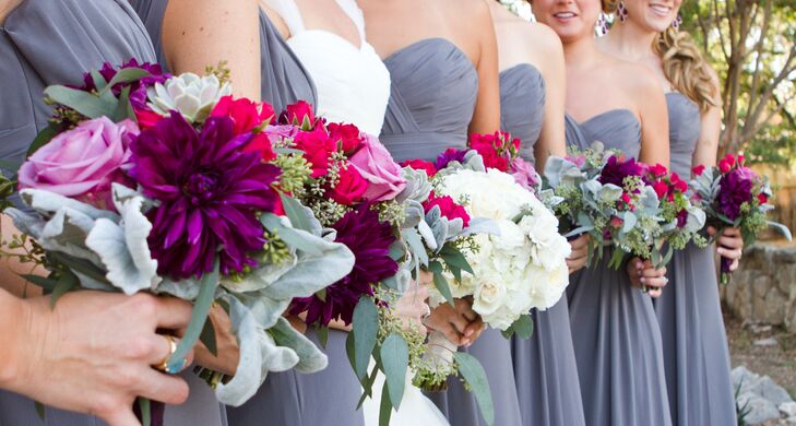 The bridesmaids carried bouquets of plum dahlias, amnesia roses, raspberry spray roses and succulents.