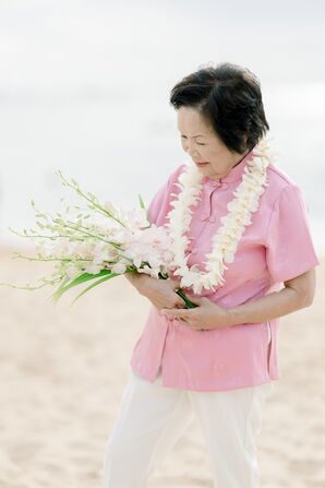 A Bride at Her Beach Vow Renewal and 50th Anniversary in Pink Suit, Bouquet