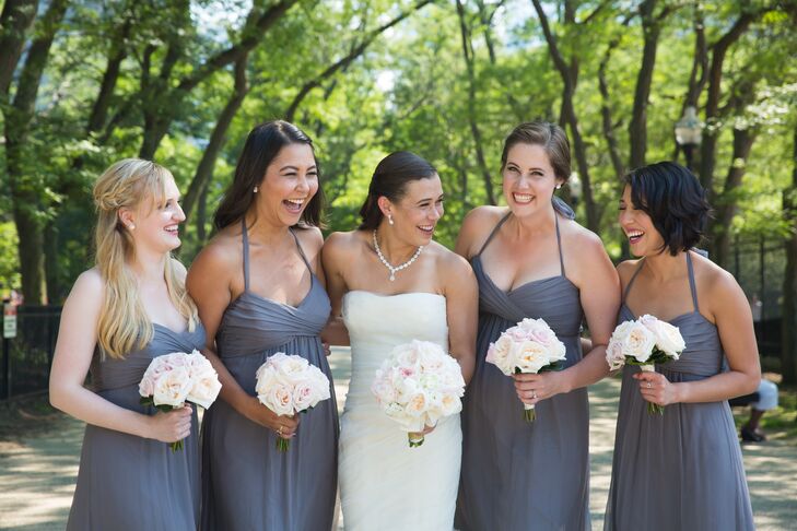 For her walk down the aisle, Emily donned an ivory Vera Wang design that incorporated French tulle and silk organza, while her bridesmaids wore gray chiffon Amsale gowns.