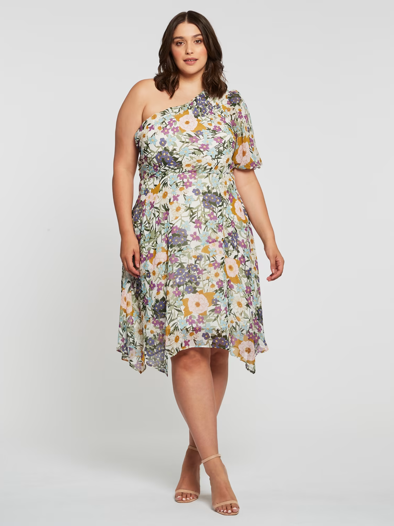 A model wears this fun and flirty one-shoulder floral gown.