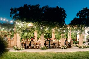Alfresco Dinner Reception Under Canopy of Greenery and Twinkle Lights