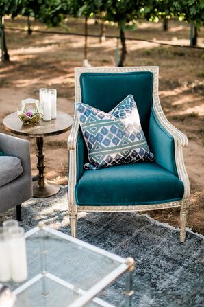 Turquoise Velvet Chair with Printed Pillow
