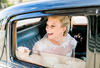 bride in vintage car