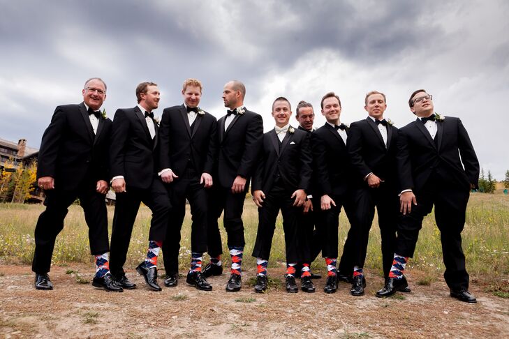 Chris stood out from the rest of his groomsmen in an ivory bow tie.  To honor his favorite sports team, the Denver Broncos, all of the groomsmen wore matching orange and blue, Broncos themed argyle socks.