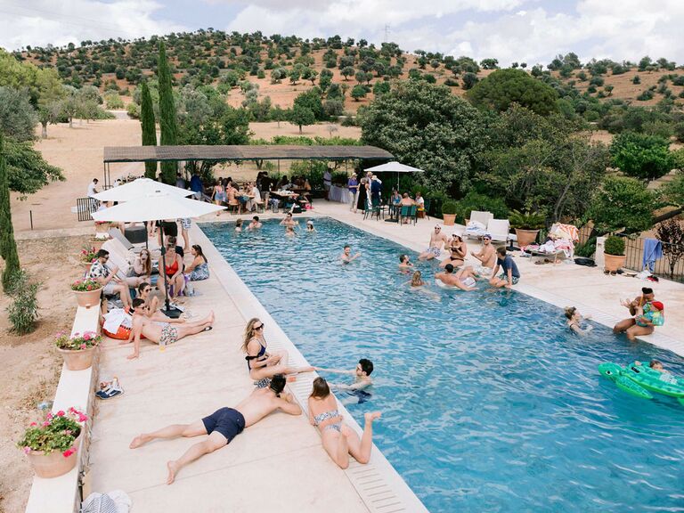 Pool party at summer wedding in Spain