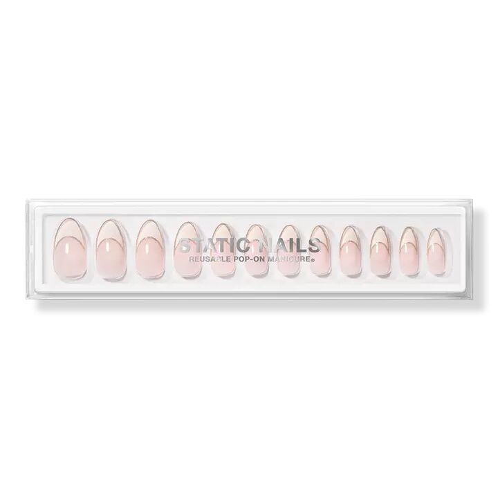 Pink shimmery press on nails with French tips. 