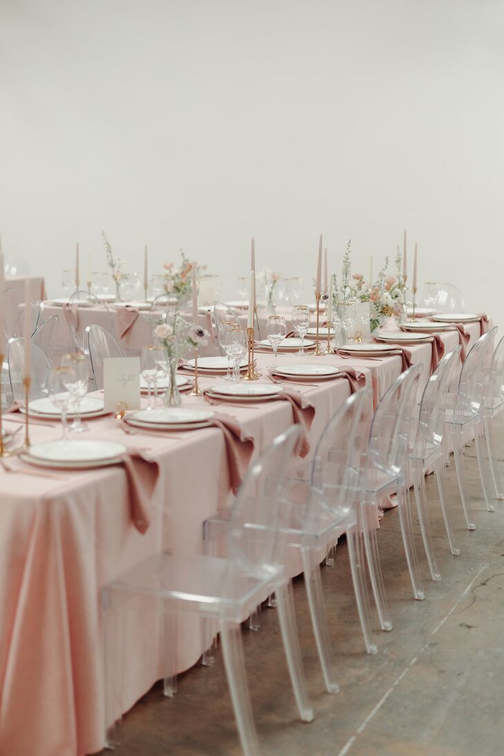 Long Reception Tables Featuring Blush Linens, Ghost Chairs, Minimalistic Centerpieces and Candles
