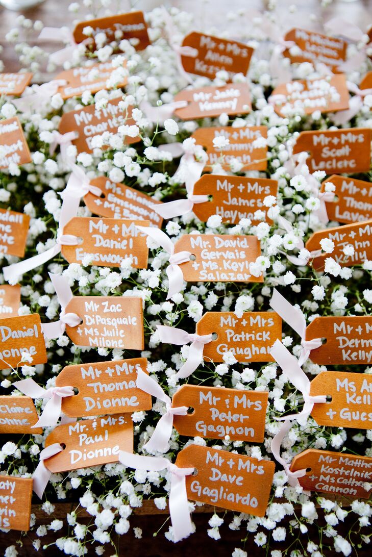 Their escort card display looked like a flower field. Each wooden card was placed on top of bunches upon bunches of baby’s breath and tied with light pink ribbon.