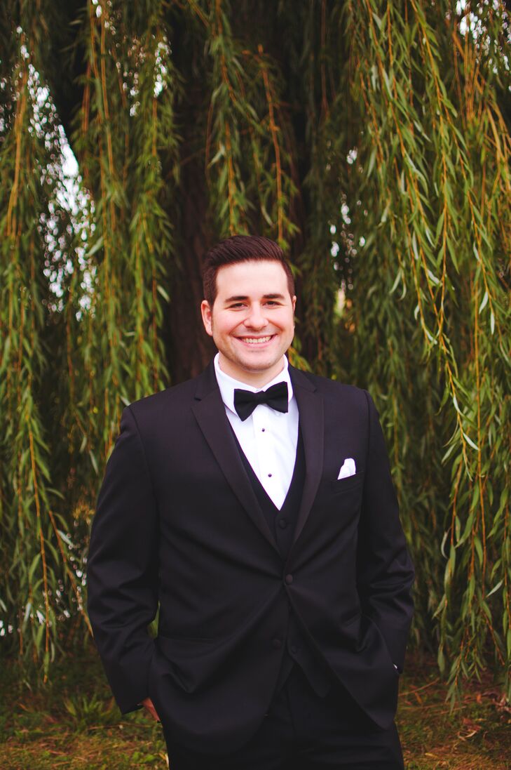 Tom and his groomsmen kept things classic in black suits paired with satin bow ties.