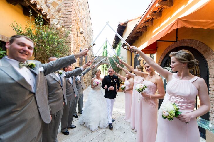 Each bridesmaid wore a blush floor-length dress from David’s Bridal in different styles for the wedding. The groomsmen wore gray suits from Men's Warehouse with white shirts and suspenders.