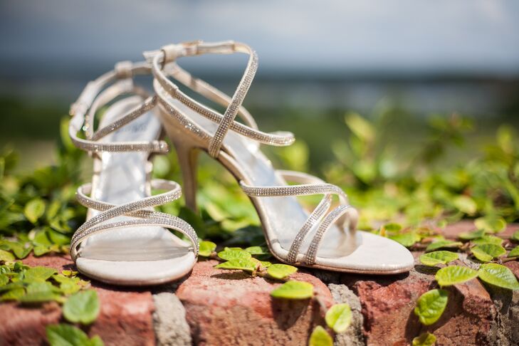 While she had originally envisioned wearing flats on her wedding day, lora chose a pair of rhinestone accented ivory heels she found while shopping with Michael. “Michael, who is never one to comment on fashion, noted that the shoes were gorgeous and I felt compelled to buy them and wear them for our wedding,” says Lora.