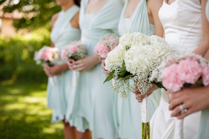 The bridal bouquet vividly stood out from the pink bridesmaid bouquets. Bridget's bouquet had purely white blooms: ivory hydrangeas accented with baby's breath.