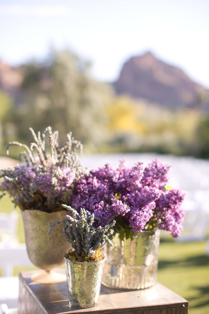 Gilded pots filled with purple lavender and lilac stood at the entrance to the ceremony and added a fresh pop of color to the decor.