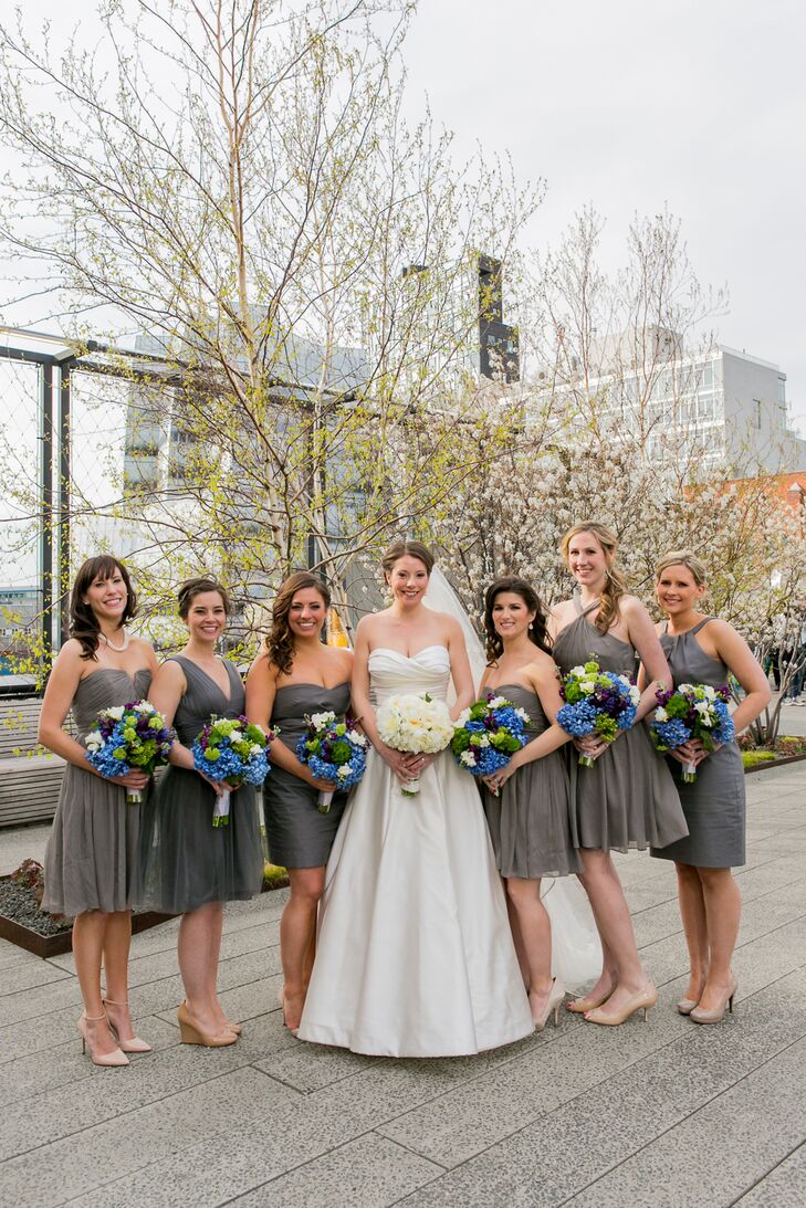 Meghan asked her bridesmaid to pick their own dresses from the J. Crew bridal collection. Her only requirement was that their dresses were all gray. " It was fun to see what each of them selected!" she says.