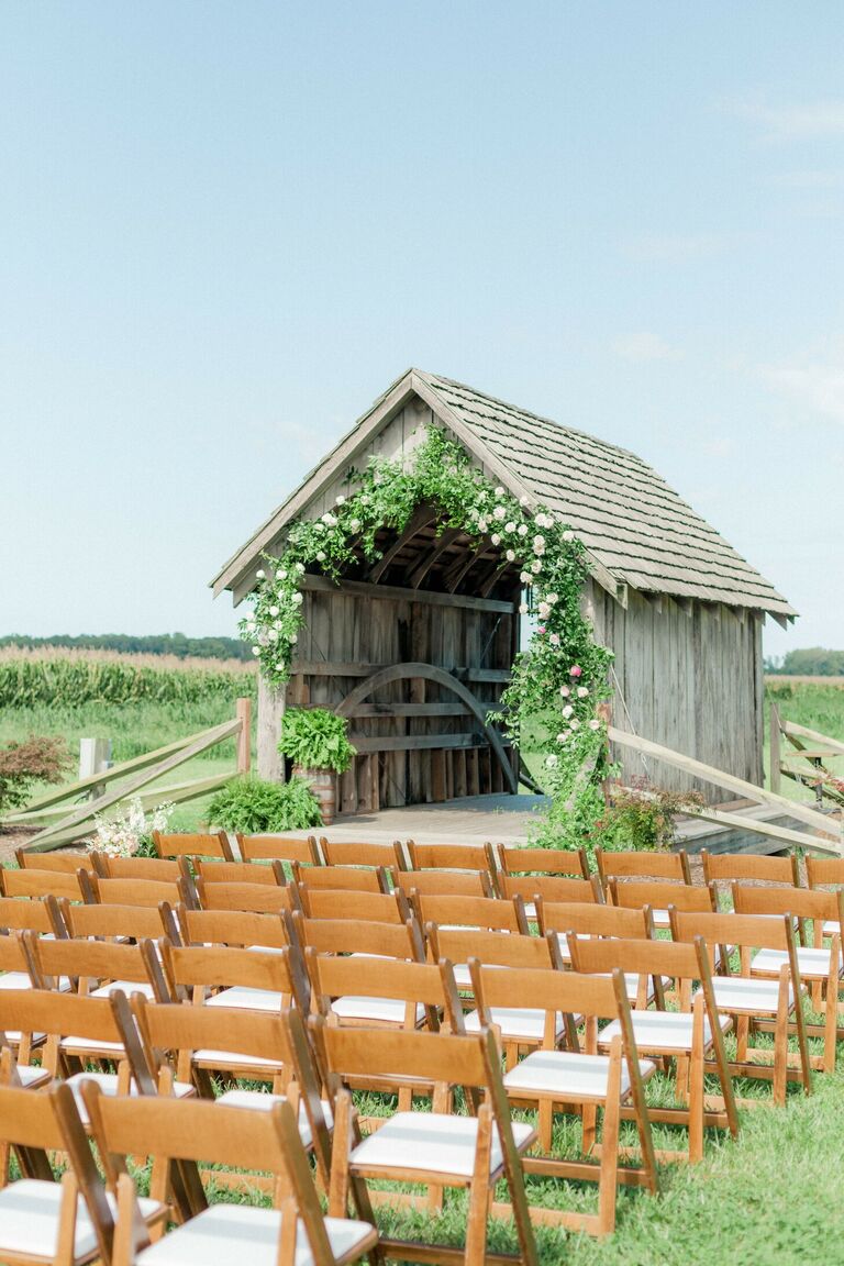 Wedding ceremony in front of a covered bridge