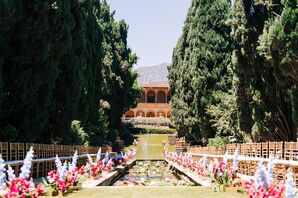 Outdoor Ceremony Aisle With Chairs Inward, Pond and Vibrant Flower Arrangements