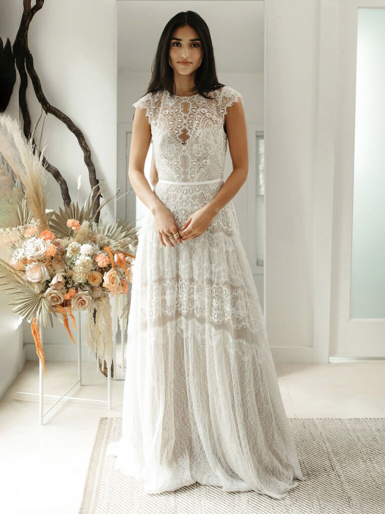 watters white lace high neck wedding dress with lace mesh cap sleeves allover chantilly lace and flowy pleated skirt