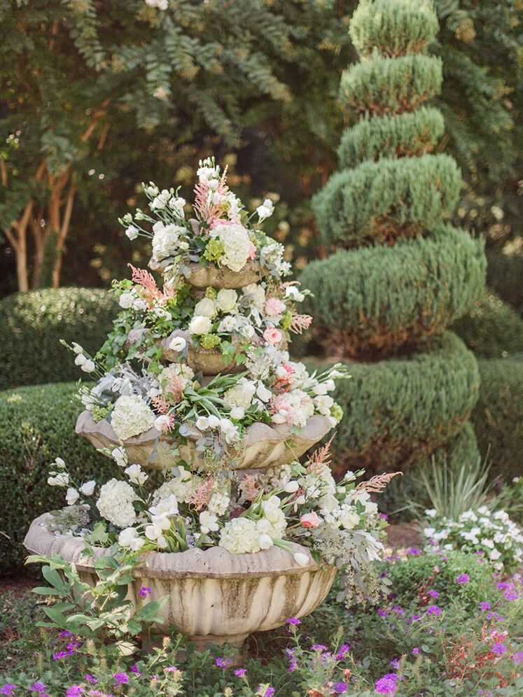 Floral wedding fountain at fairytale-themed wedding