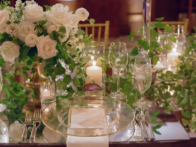Place Setting with Greenery, Candles and Glass Dinnerware