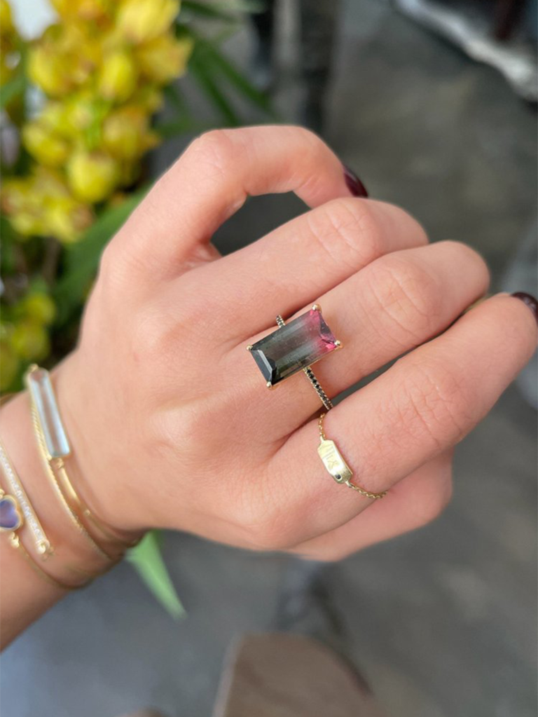 Pink and black tourmaline center gemstone on thin band with black pave diamonds