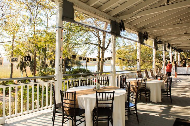 “When you are in the Low Country, there is a natural beauty and peace that takes over,” Amanda says. “We wanted to see that natural beauty in our ceremony and reception.” Amanda and Ben made the burlap table runners for the round tables and lined the wraparound porch with black-and-white pictures of their three years together. They completed the look with string lights for a romantic ambience.