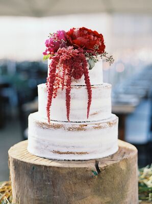 Rustic, Rough-Frosted Wedding Cake With Crimson Flowers