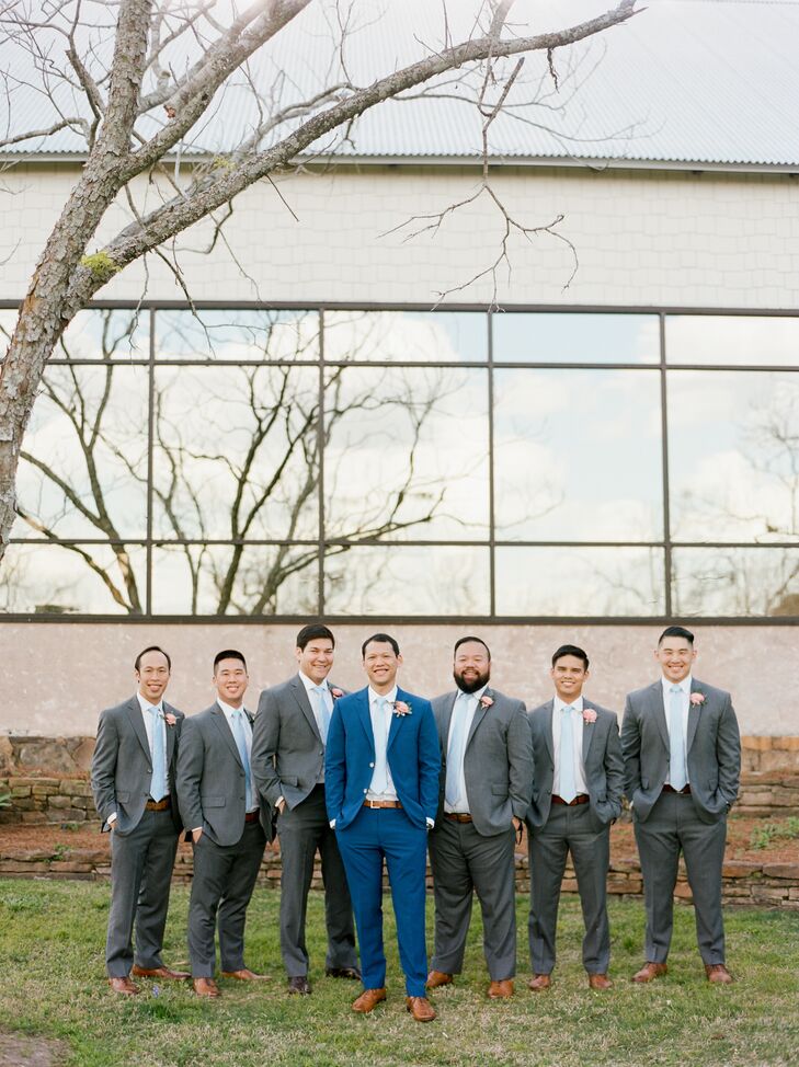 To match Elton’s bright blue suit, his groomsmen paired light blue ties with dark gray suits from Jos. A. Bank.