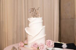 Two-Tier Wedding Cake in White With Petaled Icing and a Rose Gold Cake Topper