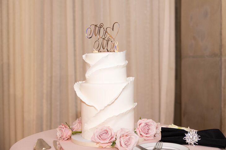 Two-Tier Wedding Cake in White With Petaled Icing and a Rose Gold Cake Topper